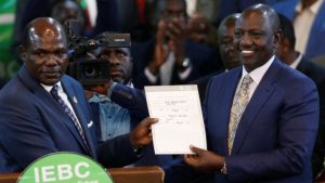 former IEBC chairman Wafula Chebukati with President William Ruto
