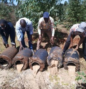 Government officials destroy illicit brew seized in past operation.