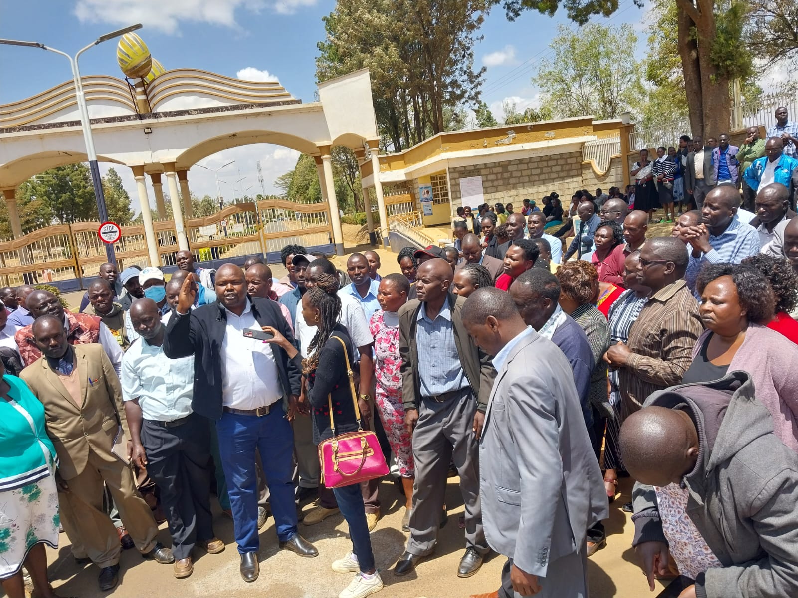 Some of the University of Eldoret teaching an non-teaching staff at the institution's main gate on March 2, 2023.