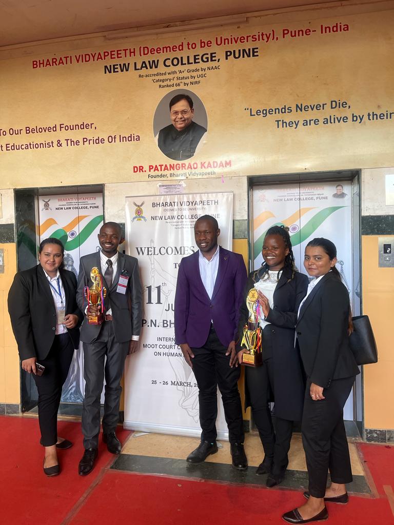 Moi University School of Law students pose with their trophies.