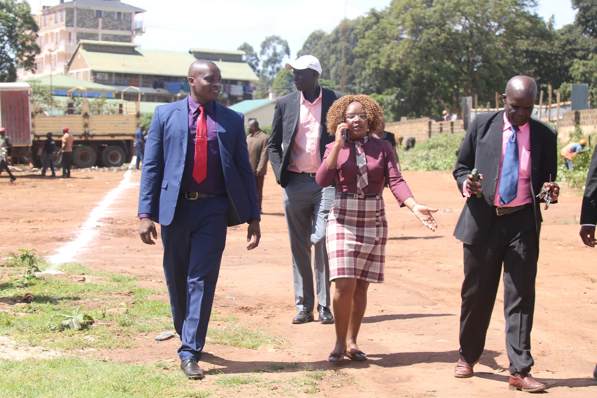 County officilas arrivng at the 1--acre piece of land that had bene grabbed.