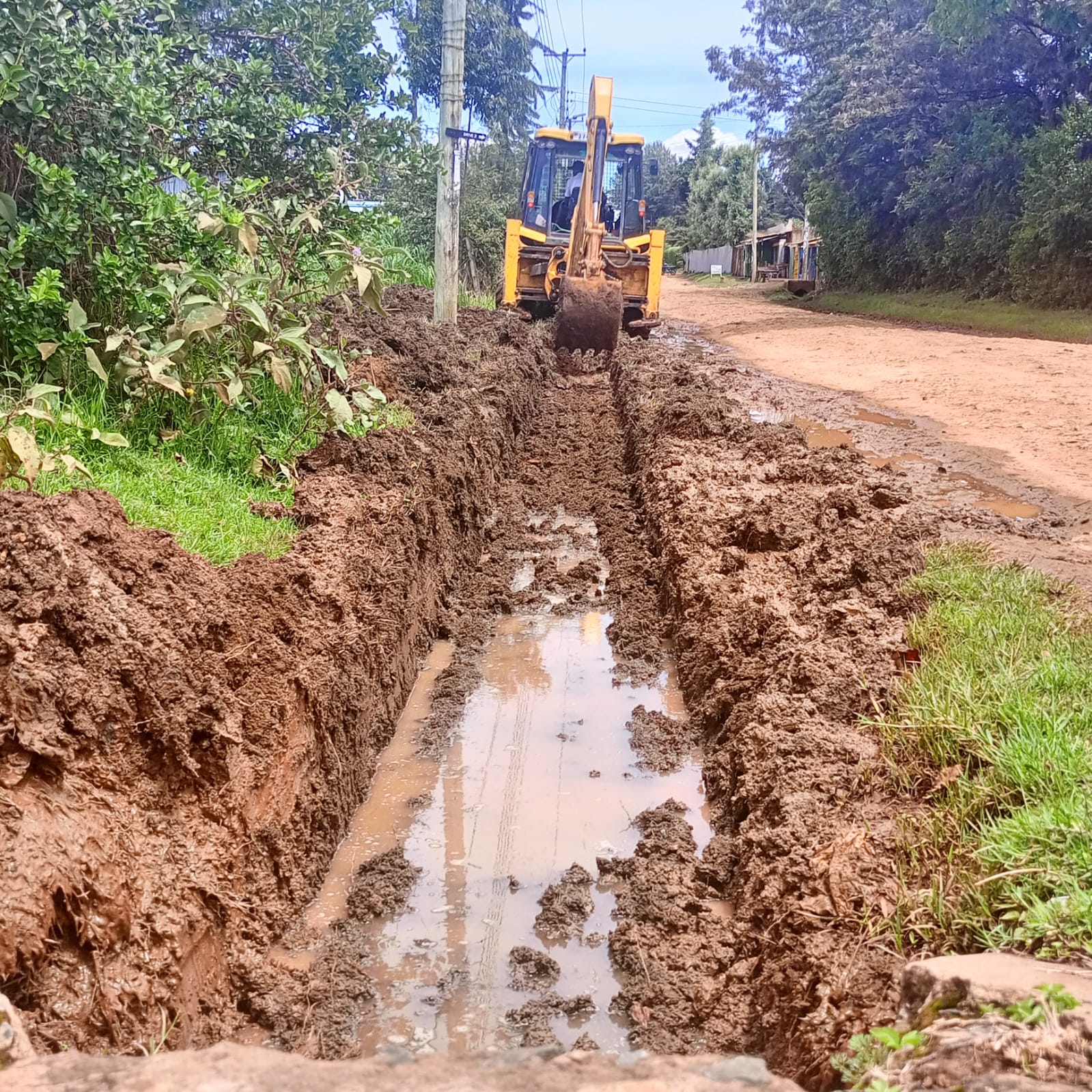 County operators opening waterways and blocked drainage lines in Kimumu ward, Moiben Sub County.