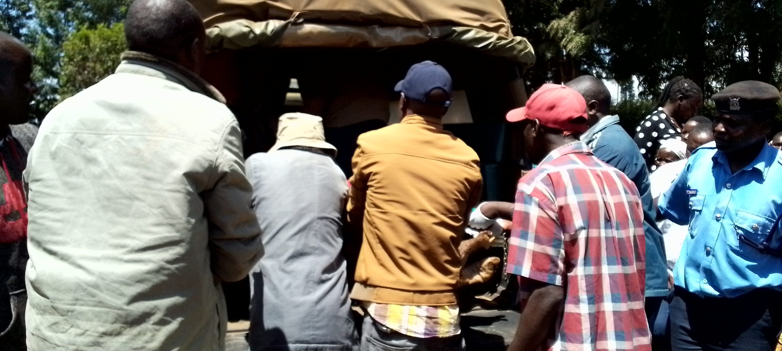 The body of the 80-year-old being loaded on a police vehicle.