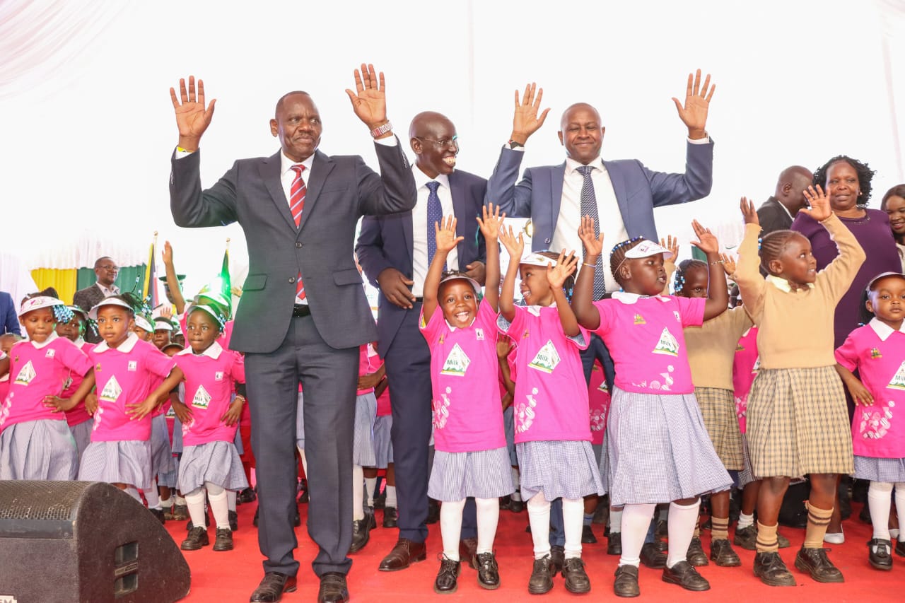 Governor Bii with Education PS Belio Kipsang and his Cooperatoves counterpart Patrick Kilemi during lauch of the milk program.