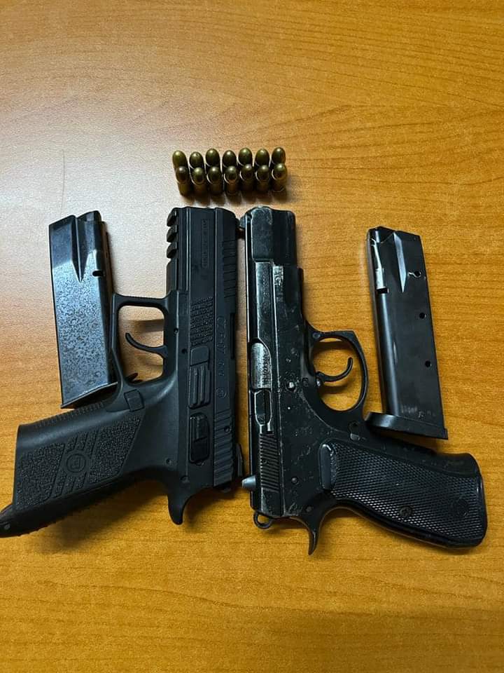The two pistols and magazines that police recovered from the suspect.