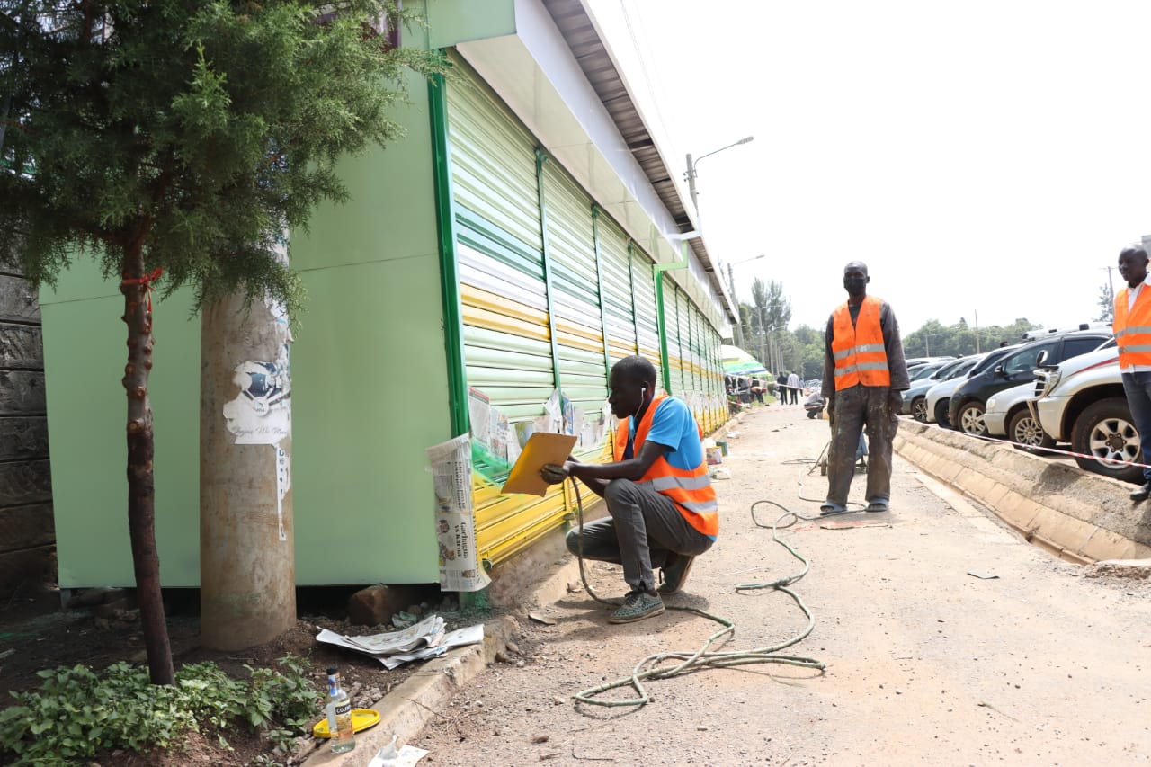 Final touches on some of the curio shops and shoe shine booths in Eldoret town centre.