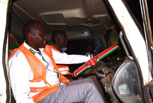Governor Jonathan Bii operating a dump truck unloading marram along the Kalyet-Toloita road in Moiben Ward, Moiben Sub County.