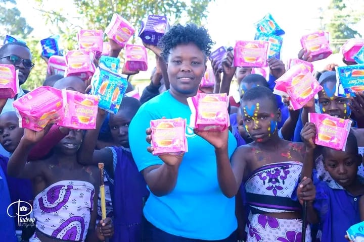 Valentine Simei, the Chief Executive officer of Fast Track Mentors at a past event to distribute sanitary towels to girls.