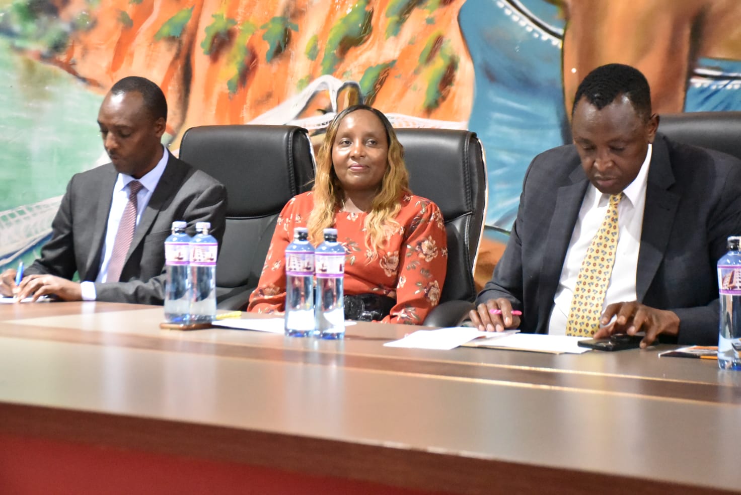 Health CECM Dr Sam Kotut (r) with Chief Officer Joyce Sang and Acting Director of Public Health Laban Kiprop during the meeting with public health officers on June 29, 2023.