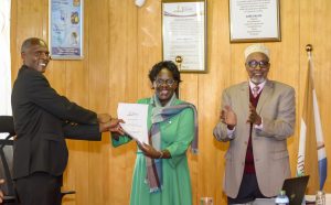 Outgoing VC Prof. Teresa Akenga with acting VC Prof. Ng'etich alongside council chairperson Dr. Ismail Buro Hassan.