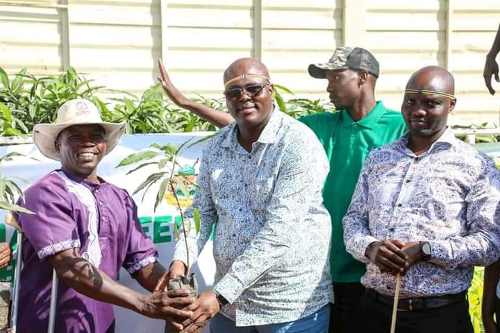 PS Dokota with one of the farmers that received seedlings.