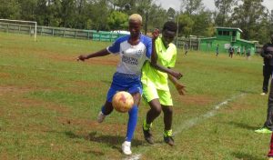Kolwa falcons Ann Atieno(left) shield the ball from Solasa's Judith Jepkemoi. Photo/James Ahela.