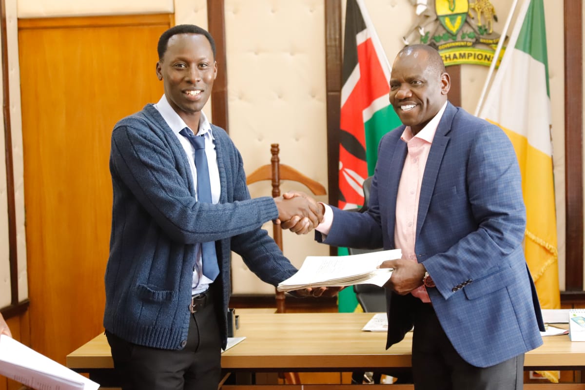 Chelilm with one of the KISIP National team members.