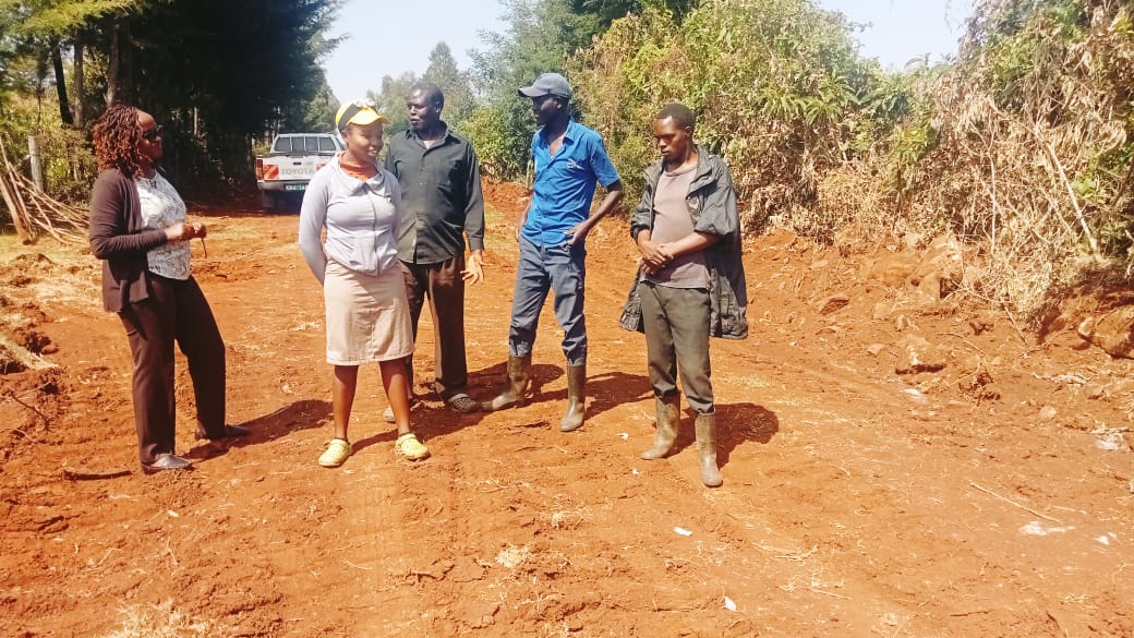 Kapseret Sub County Engineer Rachel Wangoi listens to views from residents of Ngeria ward during the inspection of Koibasui-Ngara falls road.