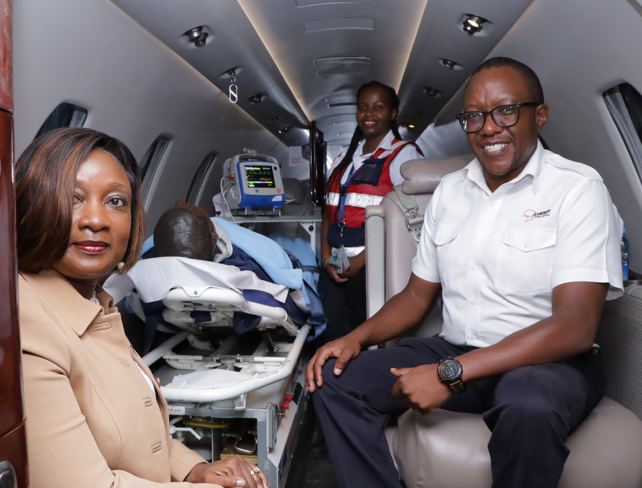 Ecobank Kenya MD & CESA - RE Josephine Anan-Ankomah and AMREF Flying Doctors Medical Director, Dr. Joseph Lelo inside an Aircraft Ambulance during the launch of Ecobank Maisha Emergency Medical Cover in Nairobi.