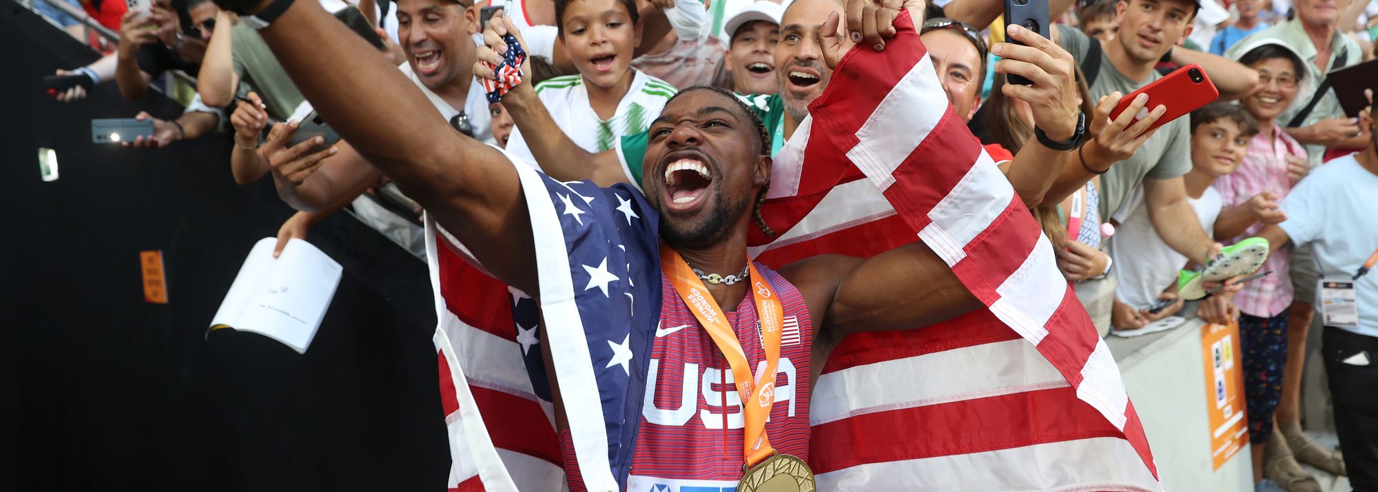 Noah Lyles celebrates with fans at the World Athletics Championships Budapest 23 (© Getty Images)