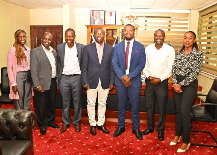Governor Sang pose for a photo with county and KMPDU officials after the meeting held at the county Headquarters in Kapsabet town.