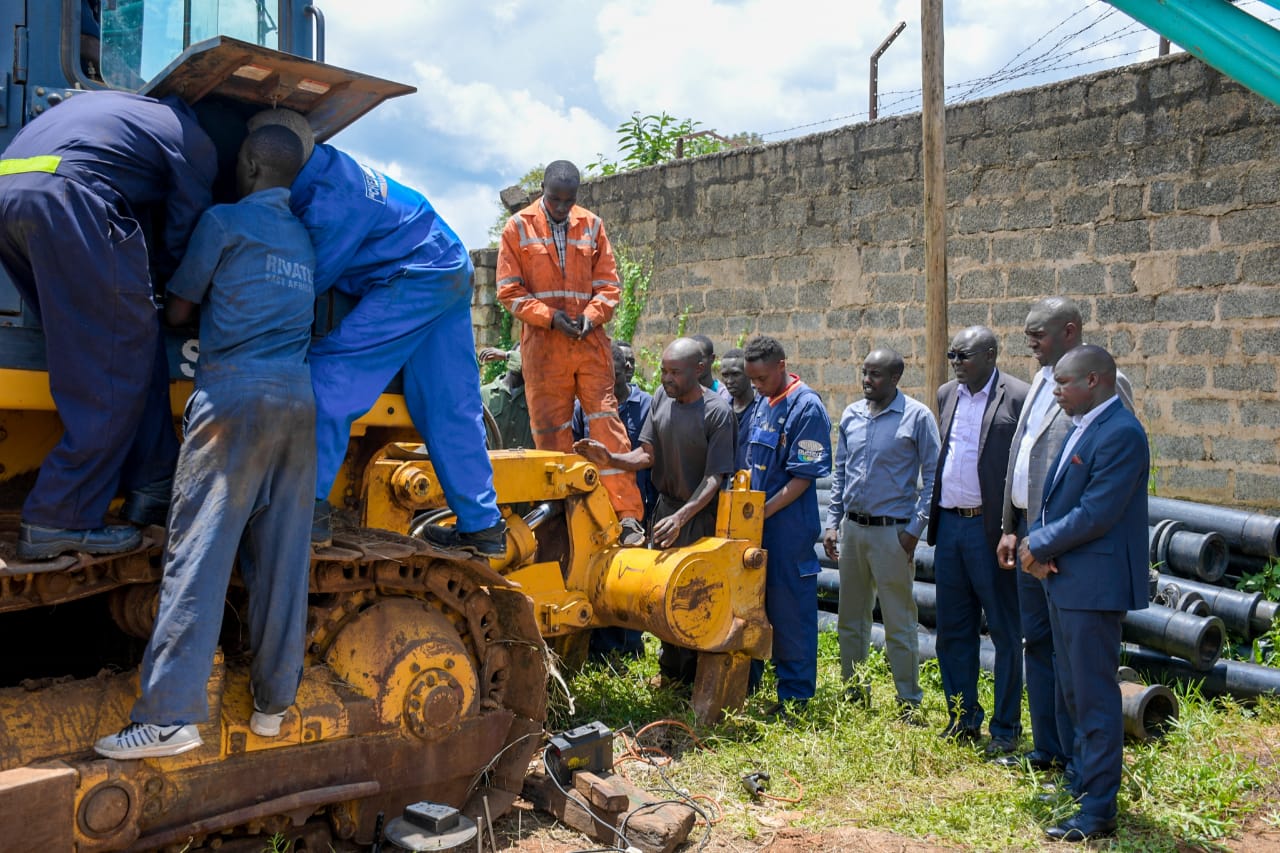 Roads Chief Officer Eng.Abraham Kiptalam (far right)leads an inspection exercise of the ongoing restoration of stalled machinery at the county Yard.