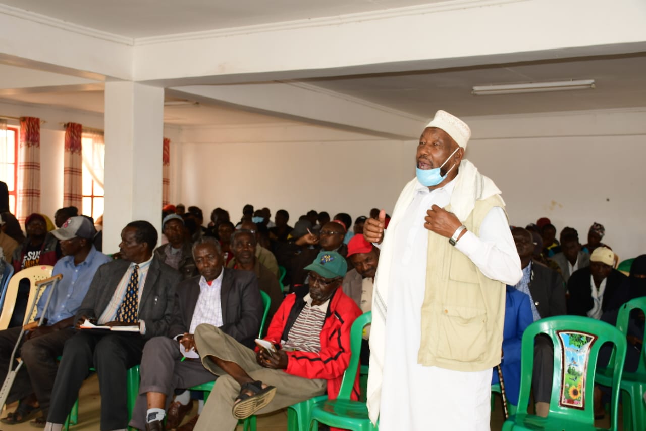 One of the Maili Nne Settlement residents speaks during the event.