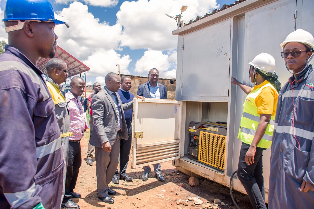 Uasin Gishu Roads CECM Eng. Joseph Lagat (in a grey suit) during the commissioning of the state-of-the-art self-banded fuel tank at the County Yard. Right is Vivo Energy Company Regional Representative Carol Olbara.