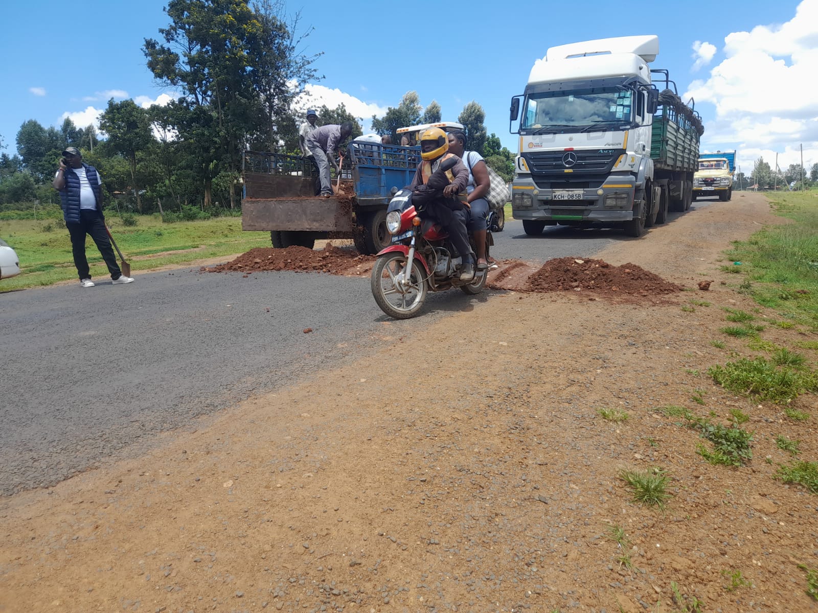 A boda boda operator crosses one of the newly erected speed pumps in the Eldoret-Kitale Highway.