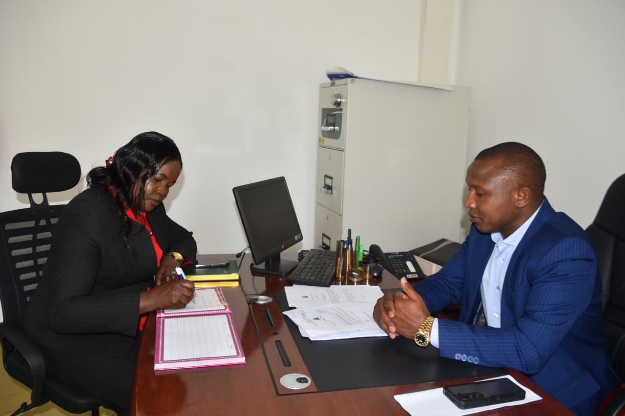 Dr Kosgey with Planning Chief Officer Nathan Korir.