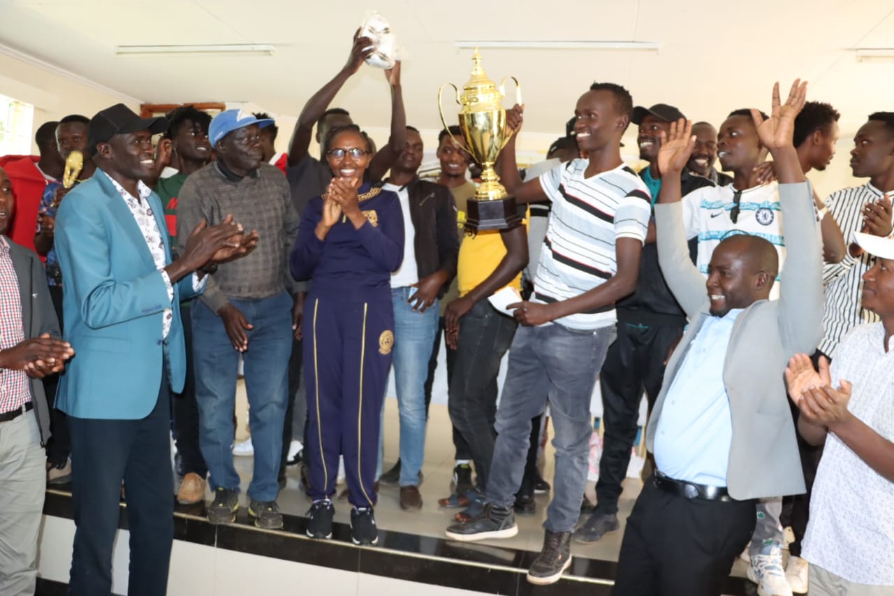 Uasin Gishu County Men's Football League winners Black Rangers with the CECM.