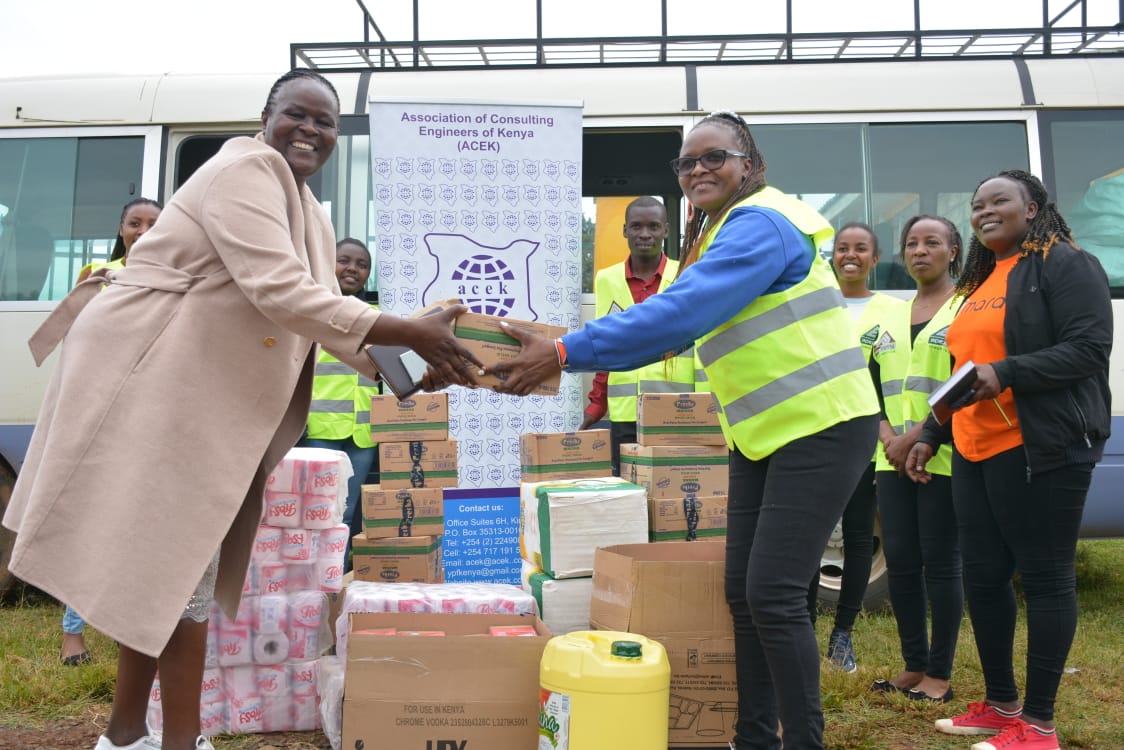 Serem receiving donations from the Association of Consulting Engineers of Kenya (ACEK).