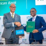 Ecobank Group CEO, Jeremy Awori and African Guarantee Fund Group CEO, Jules Ngakam exchange the USD200 million risk sharing agreement after it was signed by the two institutions on the sidelines of the AFIS Summit in Lomé, Togo