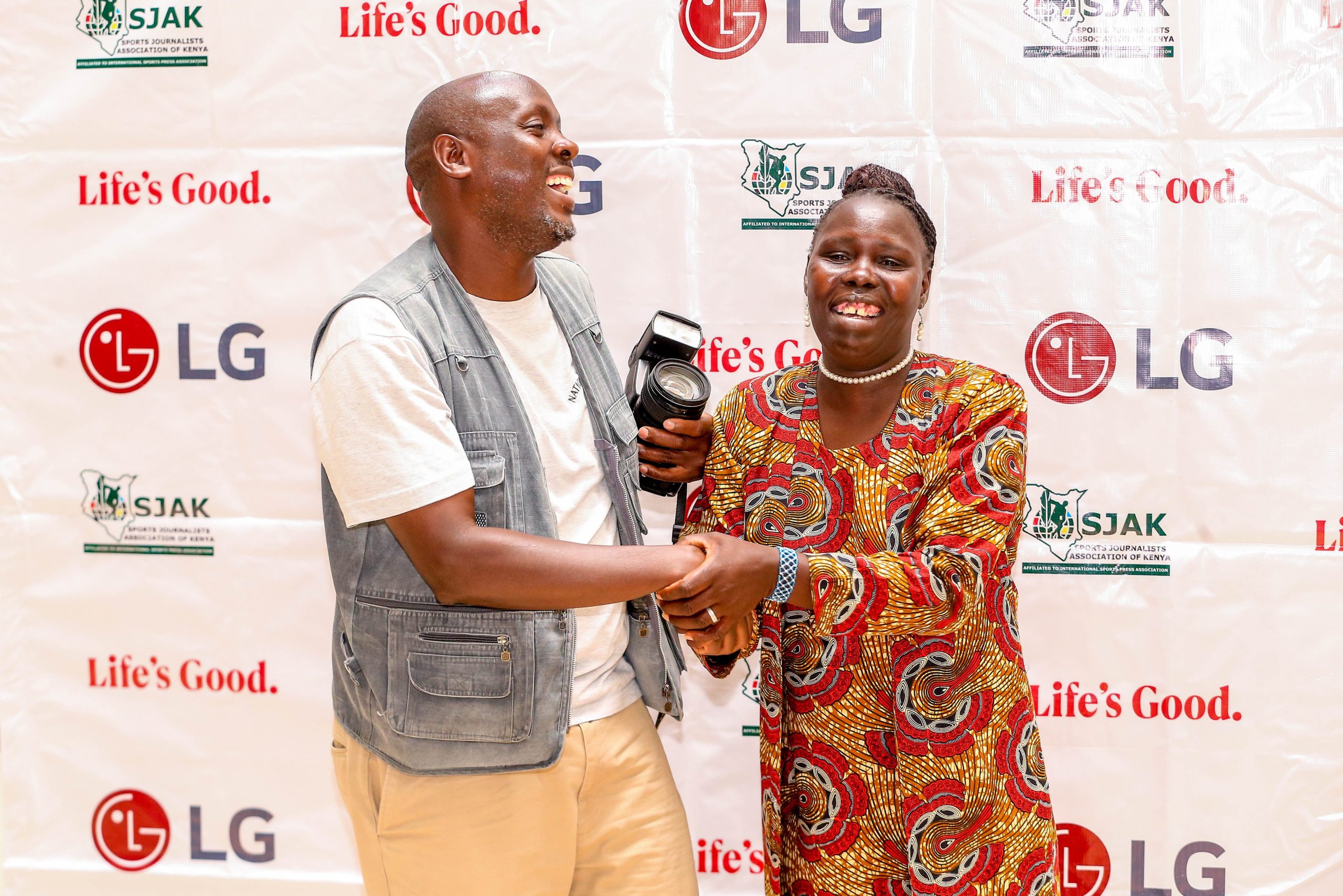 The Elizabeth Jepchirchir with Nation Photographer Jared Nyatata who captured the moment that earned her the TV set. Photo/SJAK.