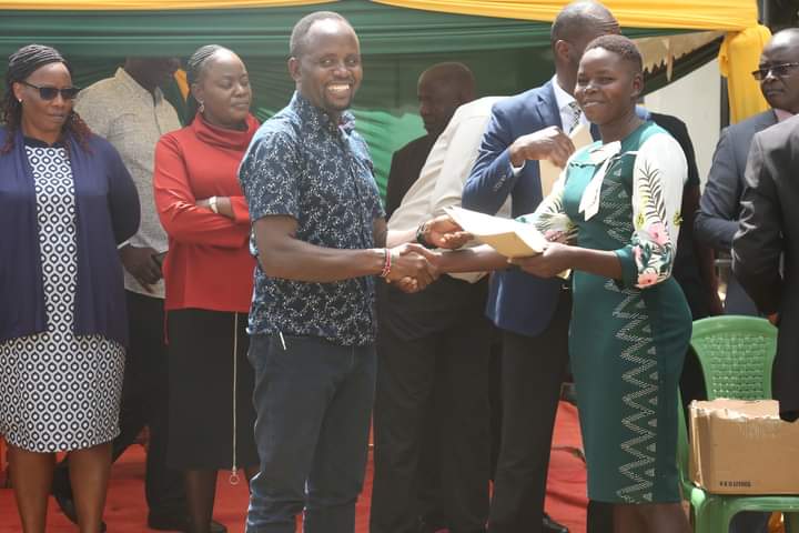Natembeya hands over appointment letters to one of the newly recruited security warden.