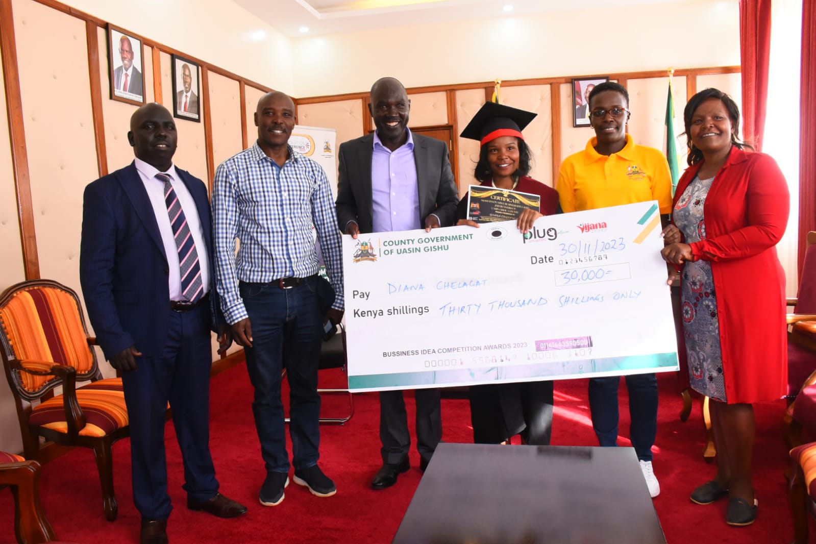 Diana Chelagat with her parents after meeting DG Barorot and Trade CECM.