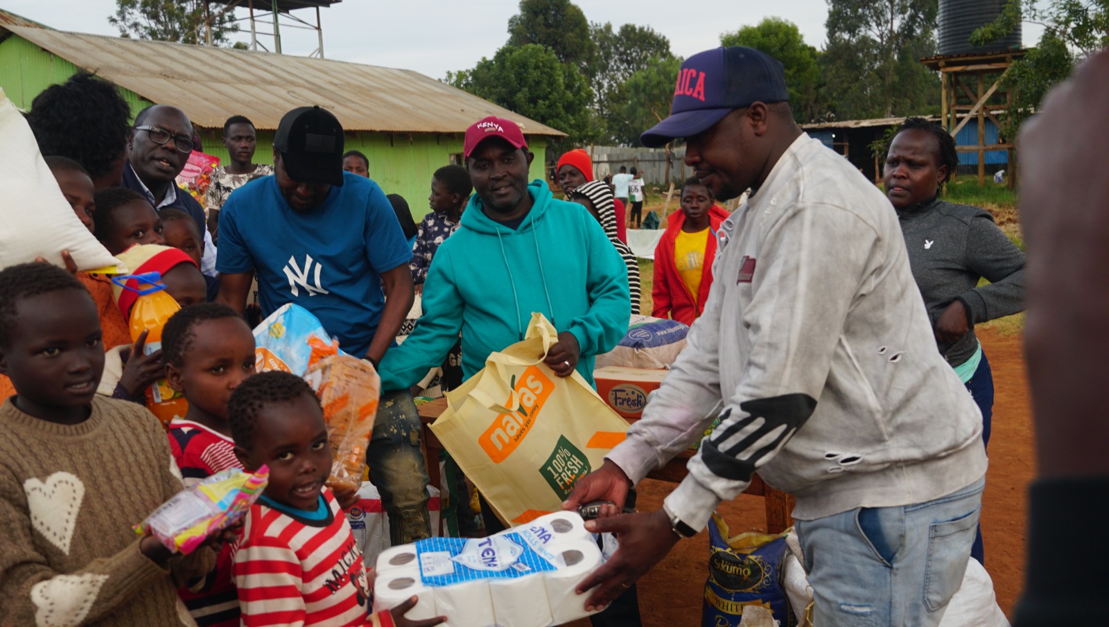 Members of the Uasin Gishu business community donating food and non-food stuff to Jesus Love Miistry Children's Home.