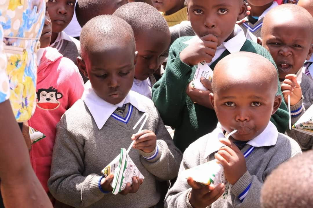ECDE learners get a taste of the milk which is distributed twice every week by the County Government of Uasin Gishu.