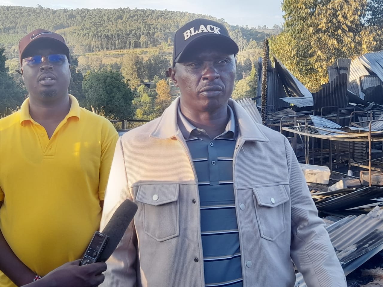 John Njuguna speaking to the press at the scene of the fire incident. Photo/Kipkorir Tarus.