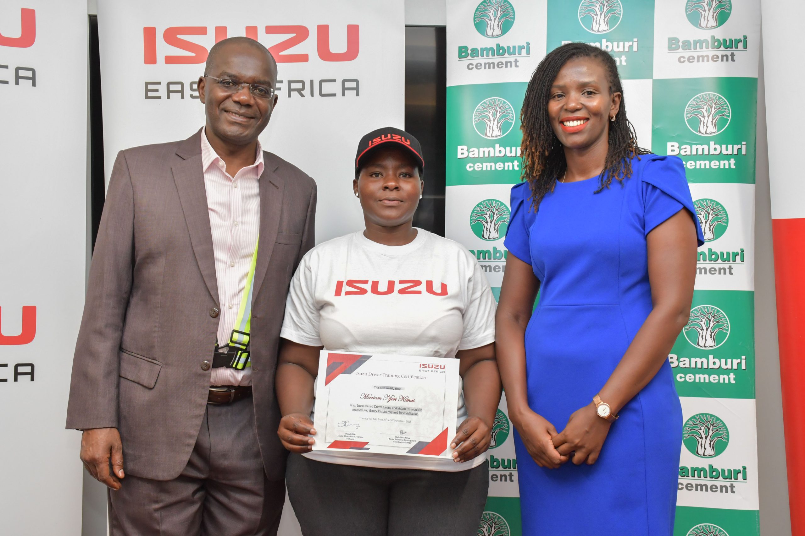 (L-R) Isuzu East Africa Human Resources and Corporate Sustainability Director,Fred Wasike, Isuzu Drivers Academy graduate, Mirriam Njeri and Bamburi Cement Plc Sustainability and Geocycle Director, Jane Wangari during Isuzu Drivers Academy graduation. So far 205 drivers have been trained, among them 51 women.