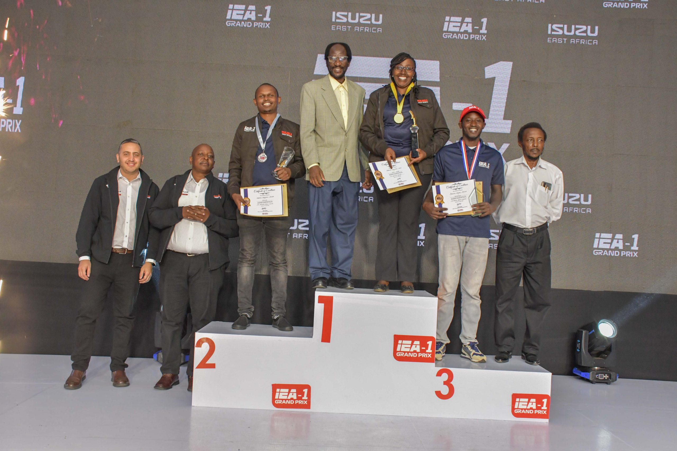  (L-R) Atlas Auto Service Directors, Slim Karmali and John Kuria, Atlas Service Advisor, Anthony Gakunyi, Veda Motors Managing Director, David Mwongo, Veda Motors Automotive Service Advisor, Carolyn Kanyiri, Kirofam Service Advisor, Samuel Mbugua and Kirofam Managing Director, Jesse Kirongothi in the 2s Service advisor category during the 2024 Isuzu East Africa Grand Prix on 17th April 2024.