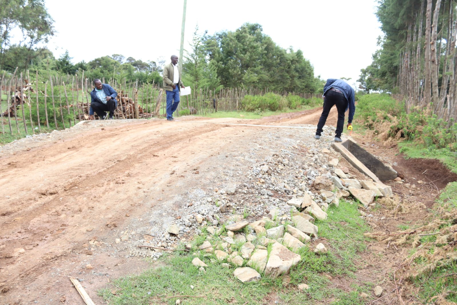 Roads officials inspecting a recently completed culvert.