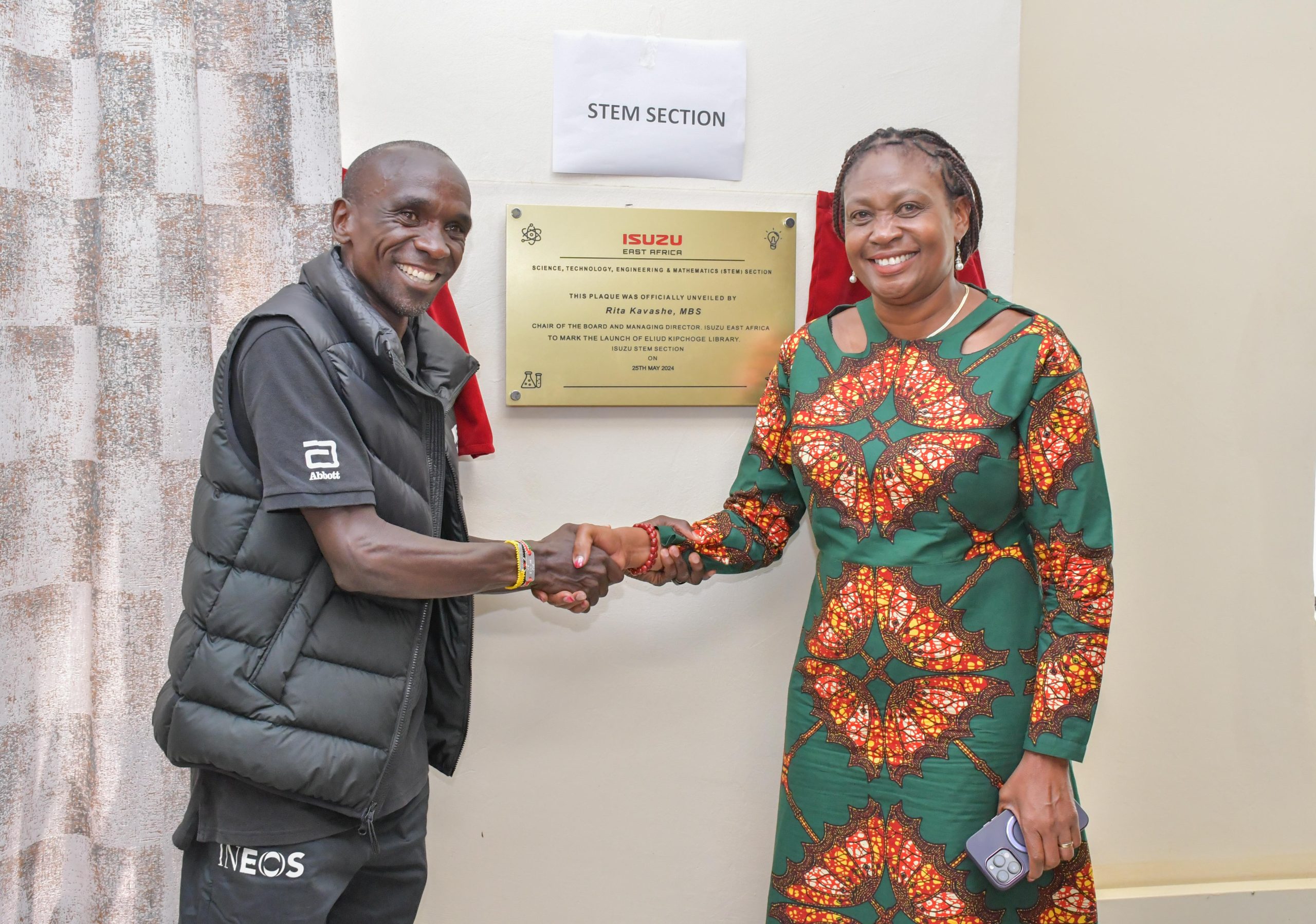 Eliud Kipchoge and Isuzu East Africa Managing Director Rita Kavashe