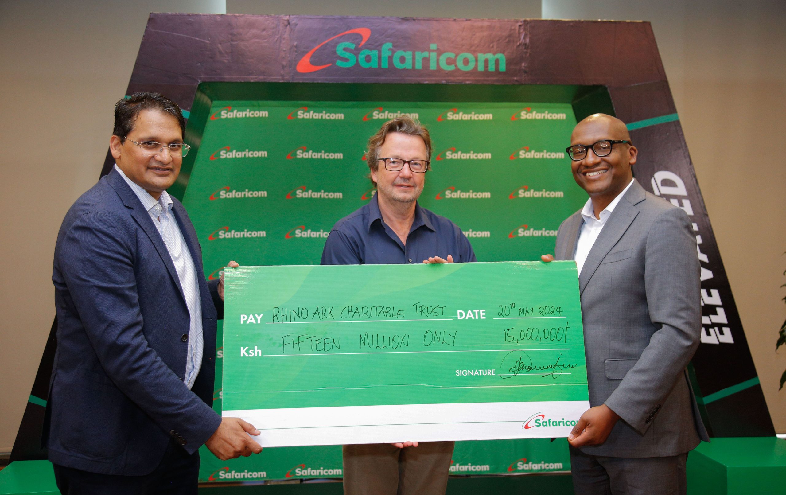 Safaricom Plc Chairman, Adil Khawaja Arshed (left) Rhino Ark Executive Director, Christian Lambrechts (center) and Safaricom plc Acting Chief Corporate Affairs Officer, Fred Waithaka holding a dummy cheque worth Ksh. 15,000,000 during the official cheque handover for the 2024 Rhino Charge sponsorship announcement.