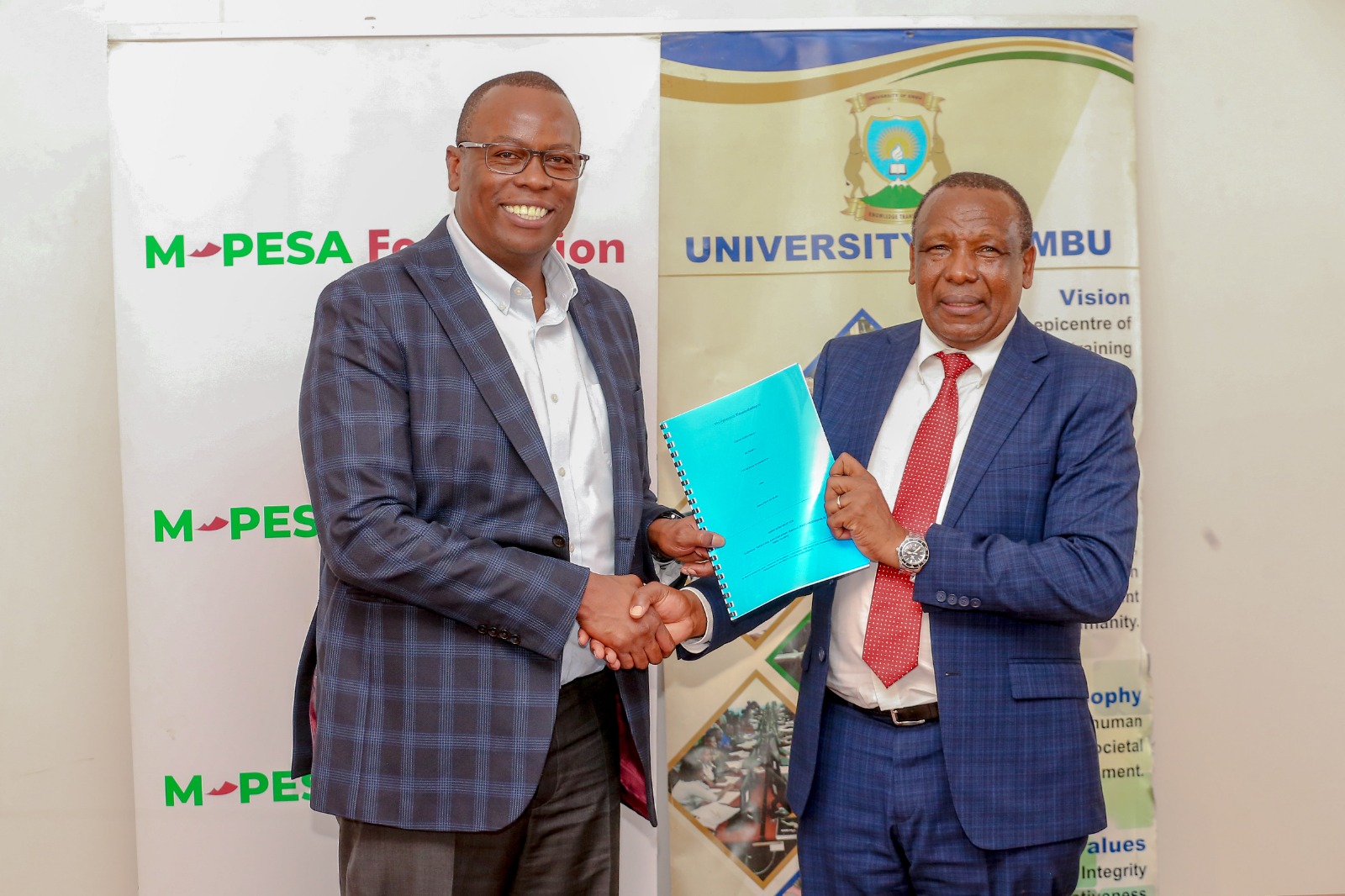 Nicholas Kamunyu, Safaricom Foundation Trustee with Professor David Mugendi, Vice-Chancellor, the University of Embu.