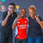 That’s how many goals we’re gonna beat them by – Gunners’ fans Carol Radull (right) and Felix Karbolo (centre) with Man City’s Lotan Salapei during the press announcement of the EPL trip winners held at Eabl Ruaraka offices on Thursday, 19th September.