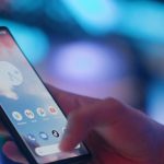 a hand holding a mobile phone