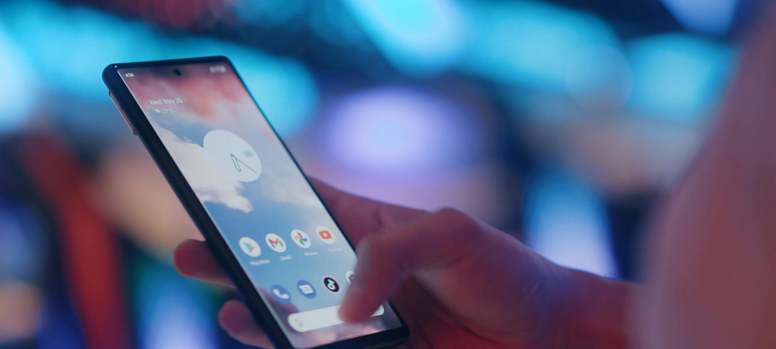 a hand holding a mobile phone
