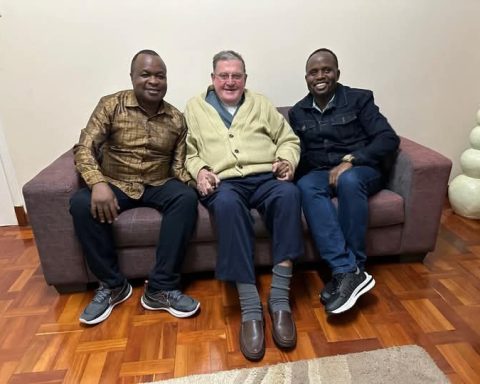 Chris Wamalwa (left), Catholic Diocese of Kitale retired Bishop Anthony Crowley (center) and Trans Nzoia Governor George Natembeya (right) sharing light moments in July, 2024.