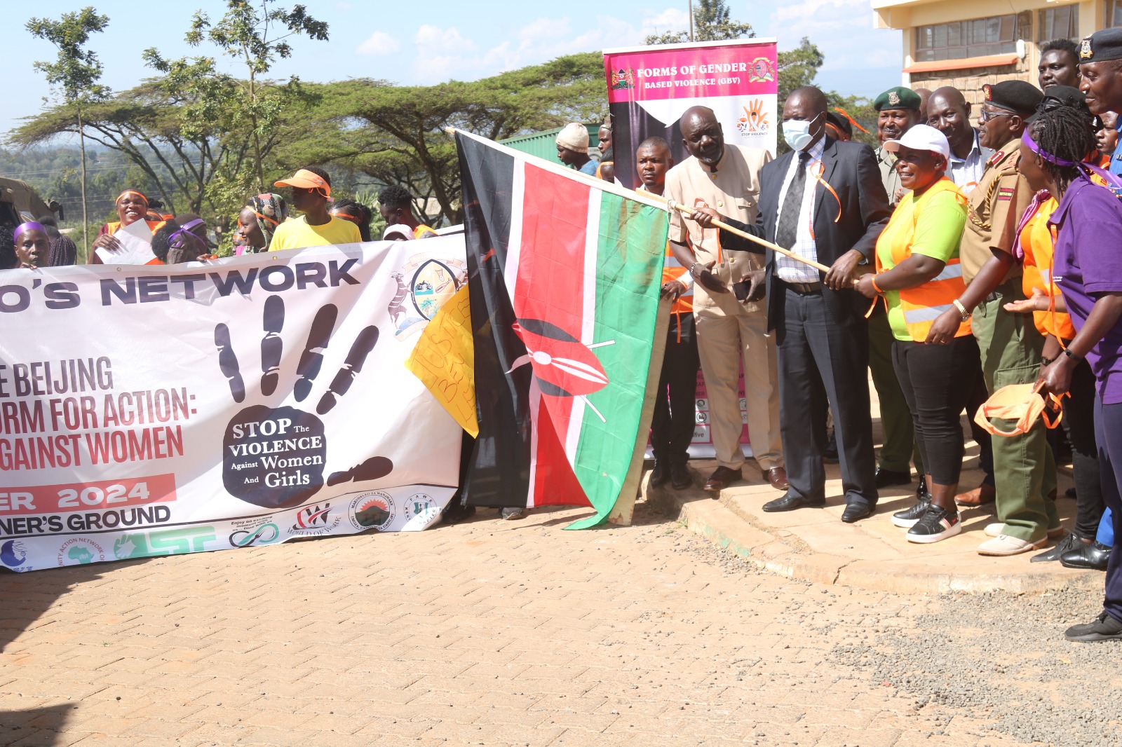 Trans Nzoia County Commissioner, Gideon Oyagi flagging off Trans Nzoia Women Leaders CBO members during the International Human Rights Day.