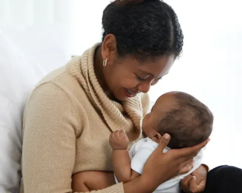 happy black mother holding a newborn