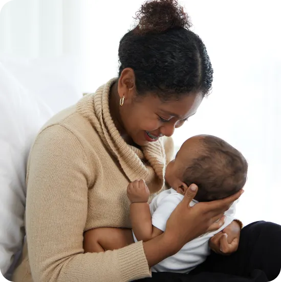 happy black mother holding a newborn