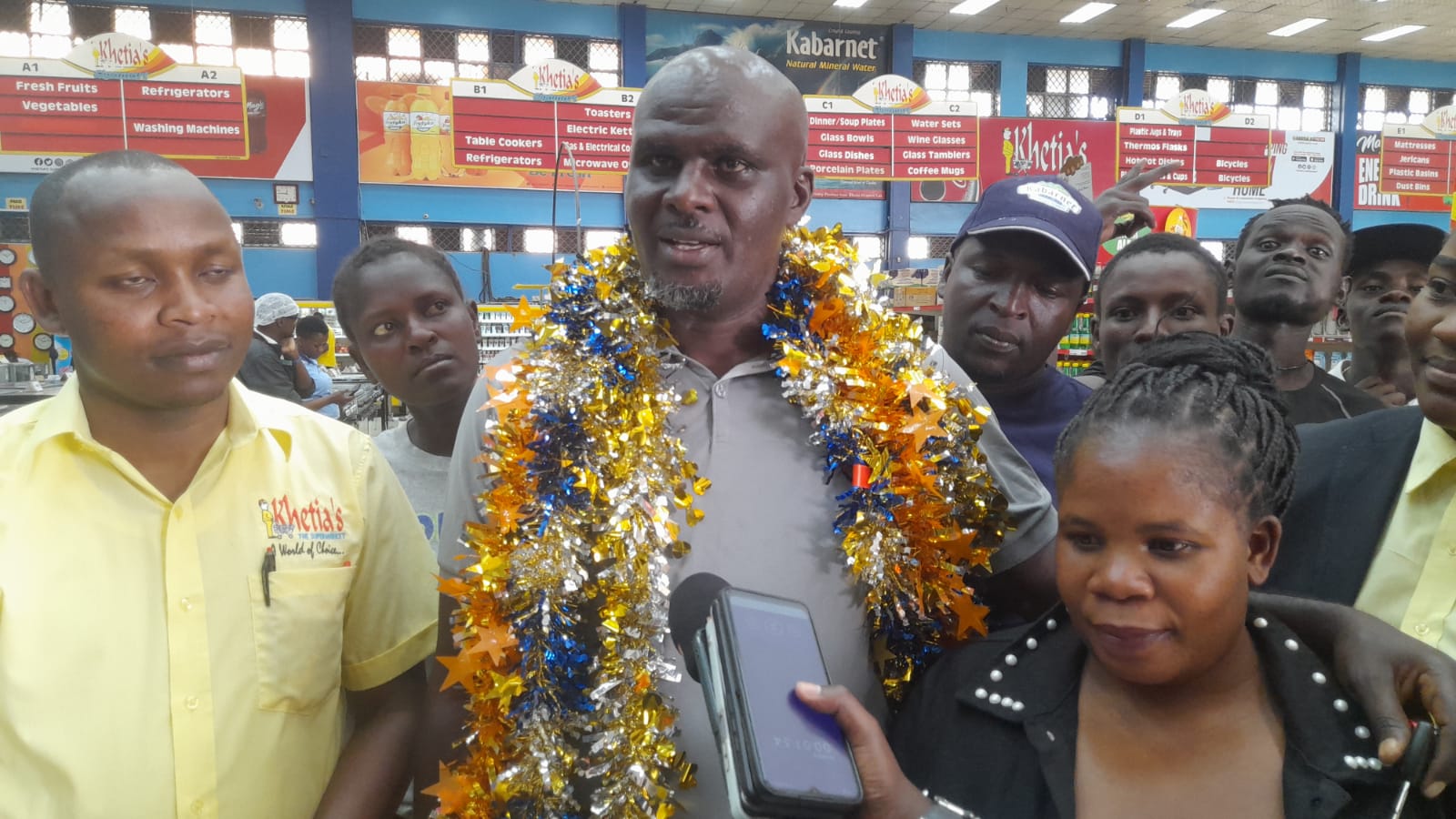 Changamka Ushinde na Khetias Supermarket promotion winner Peter Kamau