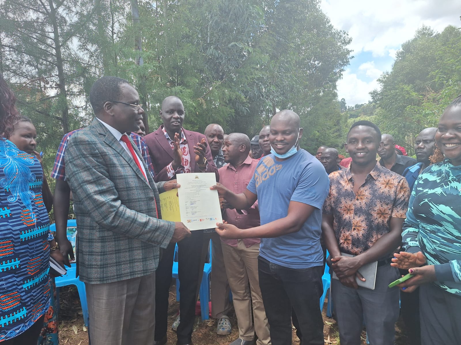 Uasin Gishu Environment, Water, Energy, and Natural Resources CECM Anthony Sitienei handing over one of the FLLoCA in Turbo sub-county